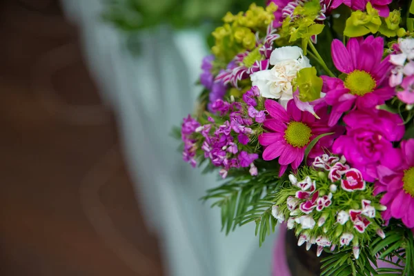 Beautiful wedding colorful purple bouquet for bride. Beauty of colored flowers. Flowers backgrounds . Beautiful bunch of purple flowers with white, red and yellow flowers .