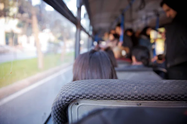 s the main mass transit passengers in the bus. People in old public bus, view from inside the bus . People sitting on a comfortable bus in Selective focus and blurred background.