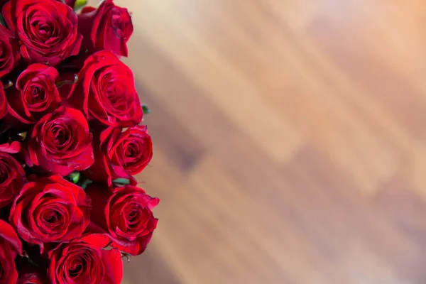 Rose blurred background. Roses flower texture. Red rose. Bouquet of red roses. copyspace . The letter A is written with white flowers . Beautiful rose flower in garden.