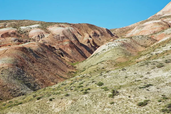 View of the beautiful striped red mountain . Red mountains in Xizi, Azerbaijan. Colorful hills . olorful geological formations . Red striped hills, rainbow mountains