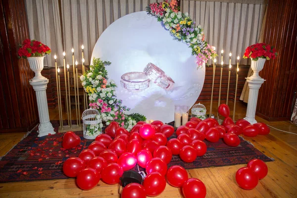 Engagement and wedding Balloon Decorations and events . Red heart balloons . light candlesticks .