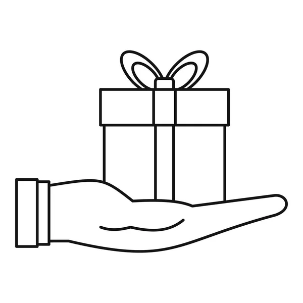Gift box in hand icon, outline style — Stock Vector
