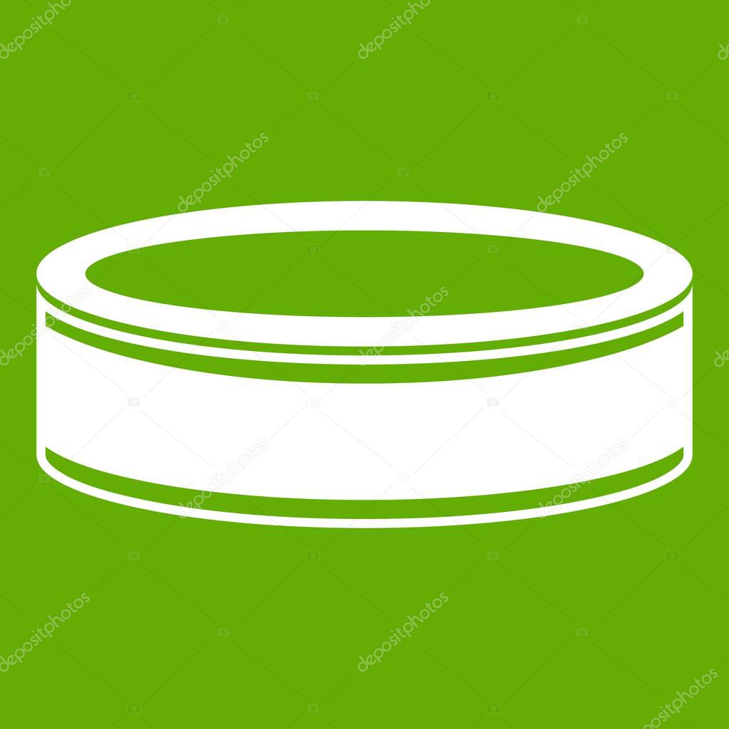Puck icon white isolated on green background. Vector illustration
