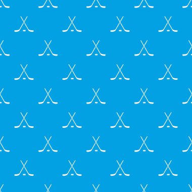 Kesintisiz mavi çapraz hokey sopaları ve puck desen