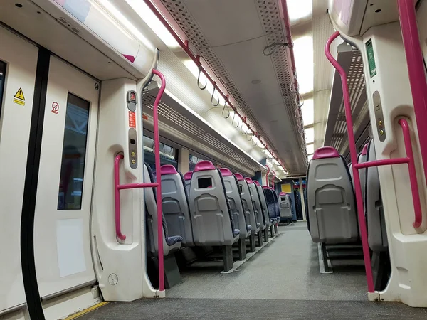 Inside of an empty wagon train. Interior view of corridor inside passenger trains with empty seats of Great Britain railway train system.