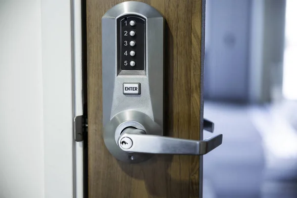 Digital smart door lock security system with a password, close up on numbers on the screenPass Code Door Handle Lock.