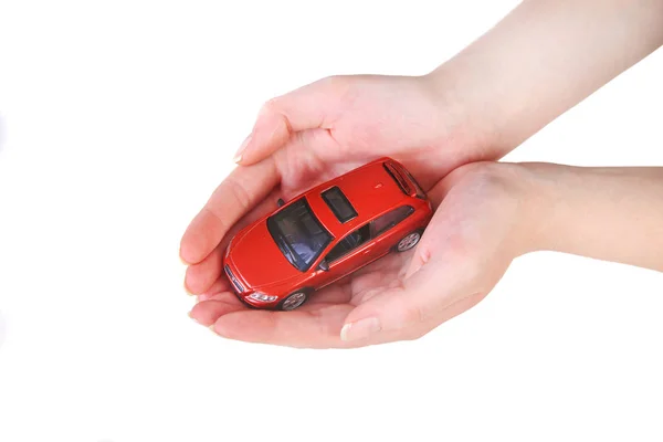 Jouet voiture dans les mains féminines — Photo