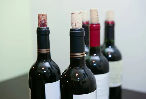 Bottle of red wine on table — Stock Photo, Image