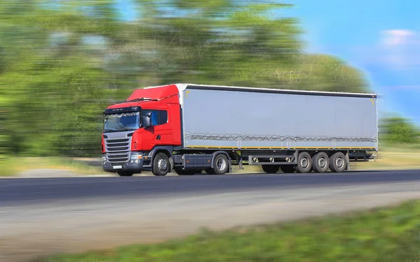 Truck moves on country highway — Stock Photo, Image