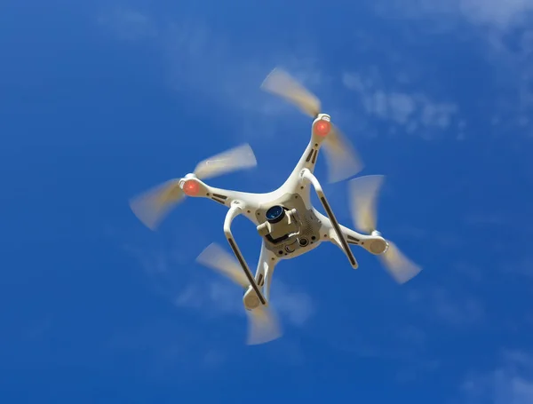 Flying drone in blue sky — Stock Photo, Image