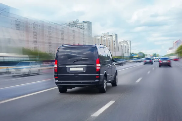 Minivan is moving on the highway — Stock Photo, Image