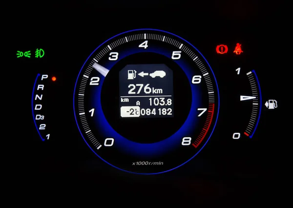 automotive tachometer on black background