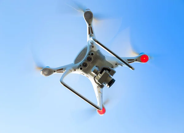 Flying drone in blue sky — Stock Photo, Image