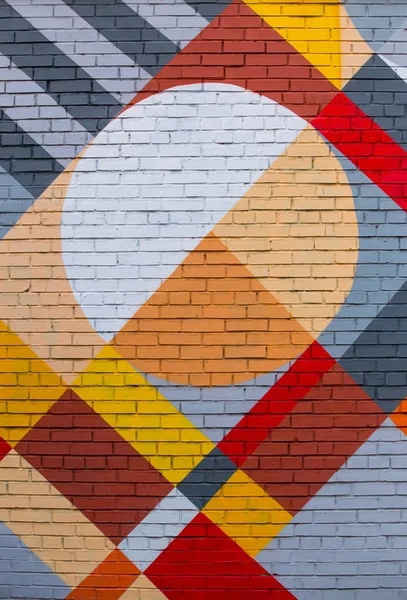 Ziegelwand mit abstraktem geometrischem Muster — Stockfoto