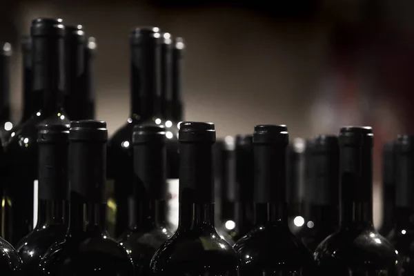 Rows Wine Bottles Dark Blurred Background — Stock Photo, Image