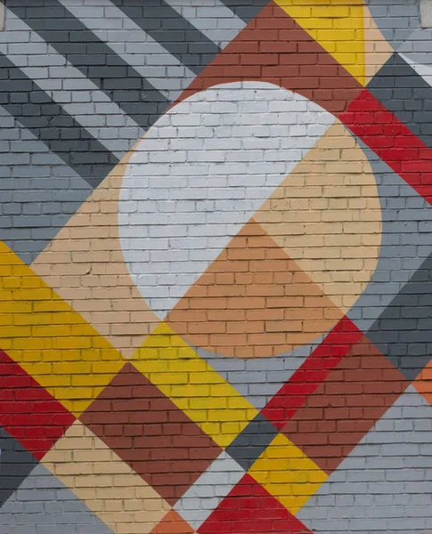 Bakstenen muur met een abstracte geometrische patroon. — Stockfoto