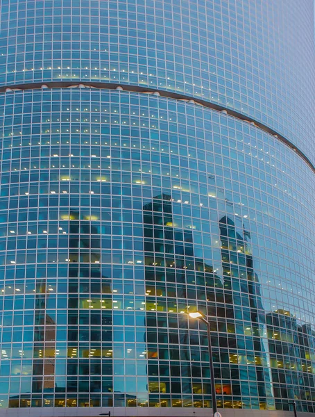 Reflection of skyscrapers in the windows of a business center — Stock Photo, Image