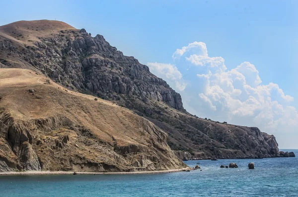 mountain by the sea on a summer day