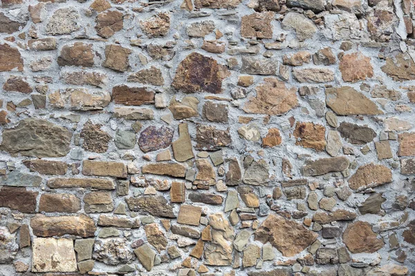 Steinmauer aus groben unbearbeiteten Steinen — Stockfoto