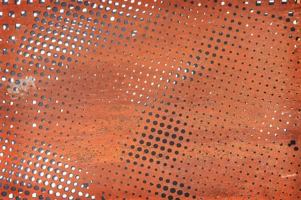 Rusty perforated metal surface. — Stock Photo, Image