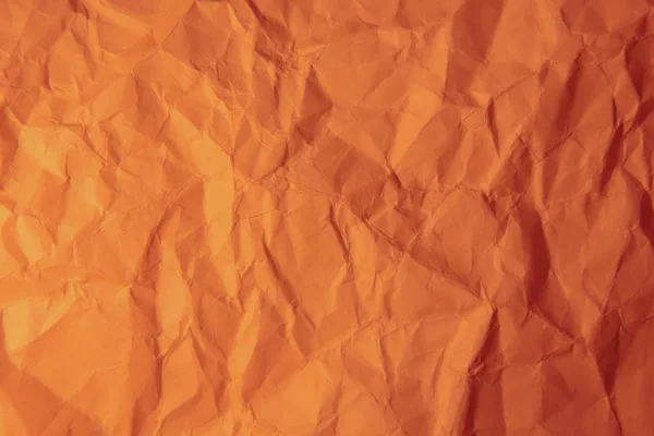 Zerknittertes orangefarbenes Papier. — Stockfoto