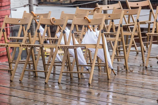 Wooden Chairs Wet Umbrellas Street Rain — Stock Photo, Image