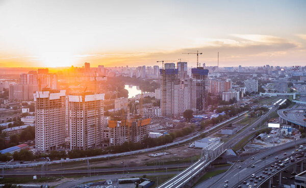 New residential district under construction in Moscow at sunset. View from above.