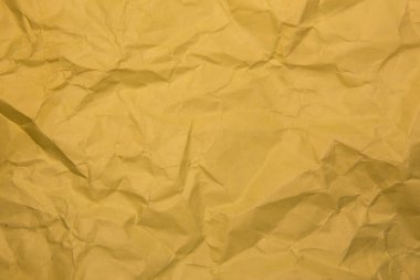 Crumpled yellow paper. Background, close-up