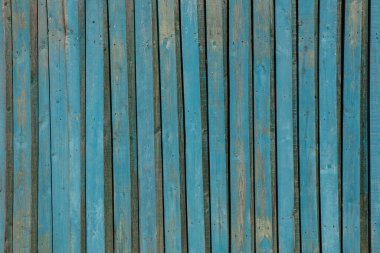 Eski ahşap tahtalar mavi boyayla boyanmış. Arkaplan