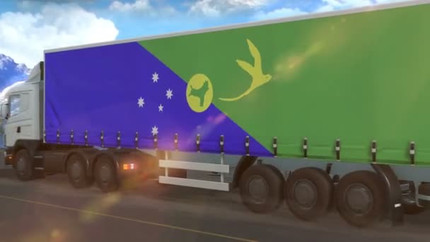 高速道路を走行する大型トラックの横に表示されるクリスマス島の旗 — ストック動画