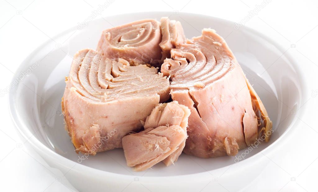 tuna isolated on white. canned fish in the plate
