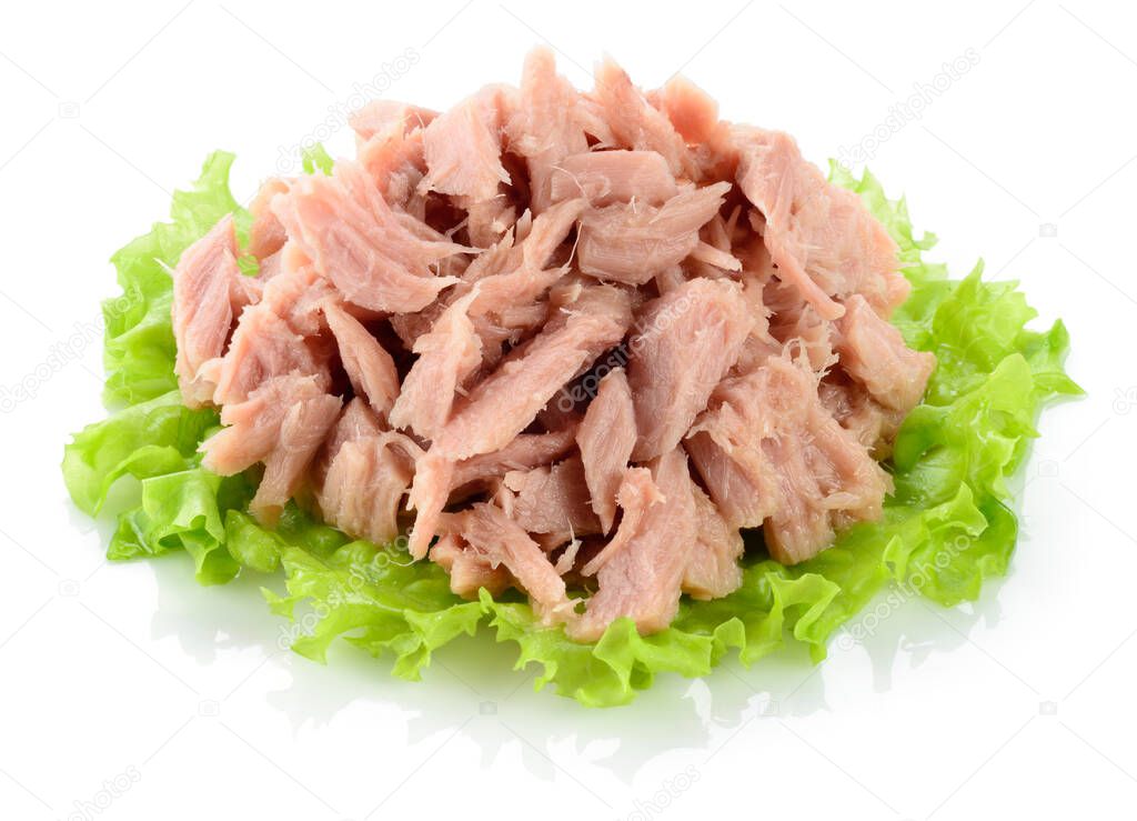 Tuna. Canned fish on green lettuce leaf