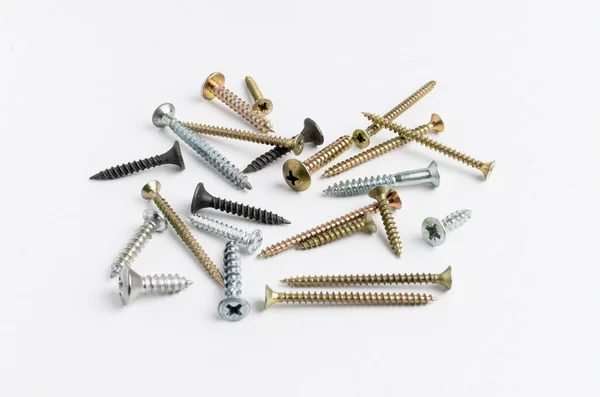 Pile of metal screws on a white background — Stock Photo, Image