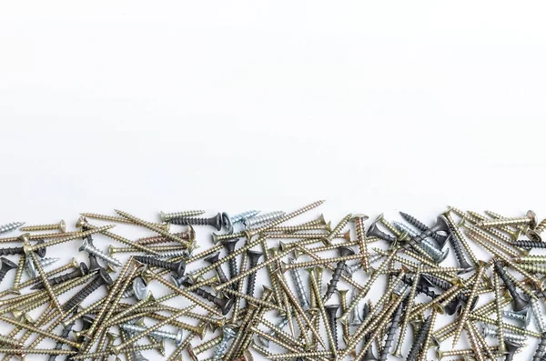 Pile of metal screws on a white background — Stock Photo, Image