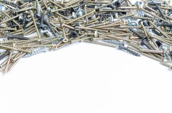 Pile of metal screws on a white background — Stock Photo, Image