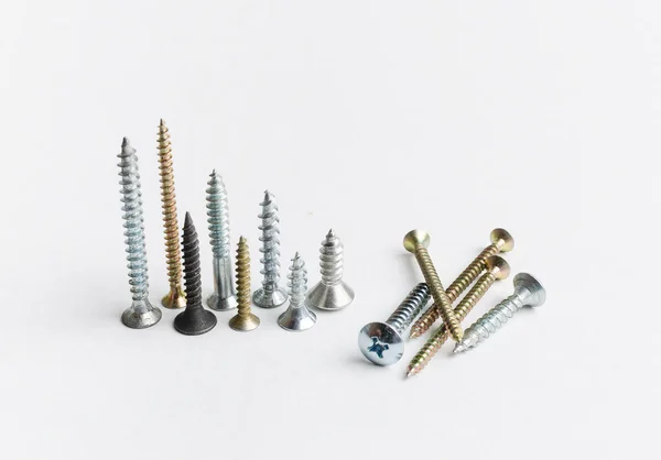 Pile of metal screws on a white background — Stock Photo, Image