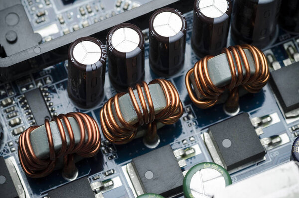 Ferrite rings with copper wire on electrical Board