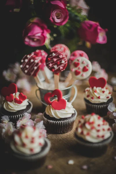 Valentine day with cup cake and cake pops on the table,selective focus