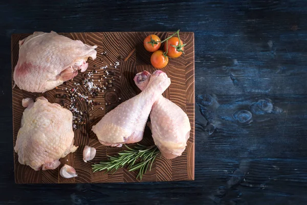 Raw chicken meat served on cutting board,blank space