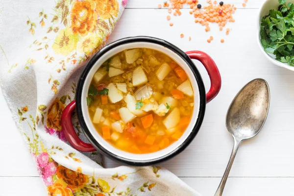 Top view of vegetable soup with red lentil on white wooden backg — Stock Photo, Image