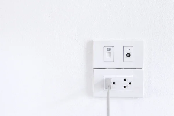 White electric plugs on wall background,White outlet interior, interior electric outlet in home,Socket electricity interior