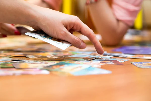 A woman\'s hand sorts out metaphorical associative maps