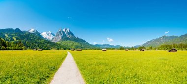 Mountain panorama in front of blue sky  clipart