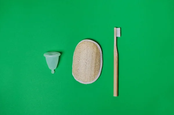 Pumpkin washcloth, bamboo toothbrush, menstrual cup. Zero waste kit — Stock Photo, Image