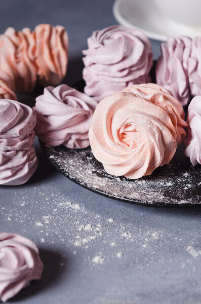 Colorful Air marshmallows on gray background. Fresh homemade sweet zephyr