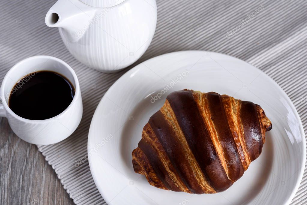 French breakfast with croissant and coffee