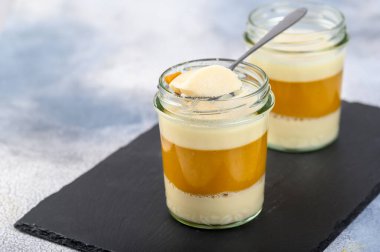Dessert. Coconut milk panna cotta with mango, italian dessert, homemade on a light background. Place for copy space clipart