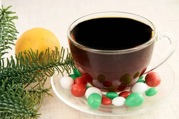 Branch eaten. Multicolored candy. Hot tea. Mandarin — Stock Photo, Image