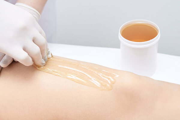 Cosmetic procedure. Depilation with wax. Beauty and health. Bright skin