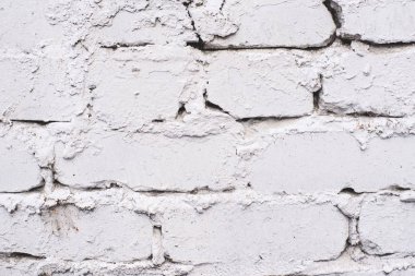 Eski tuğla. Beyaz kaplama. Pürüzlü yüzeye
